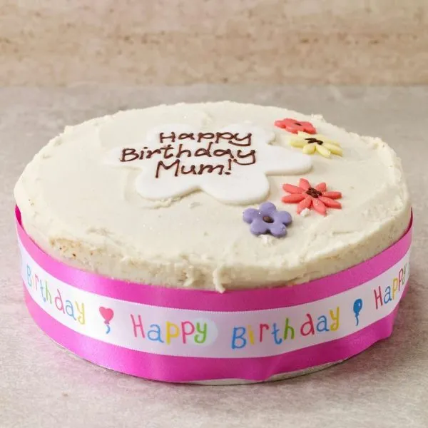 Vegan lemon birthday cake with pink ribbon. Egg and dairy free, no nuts or soy