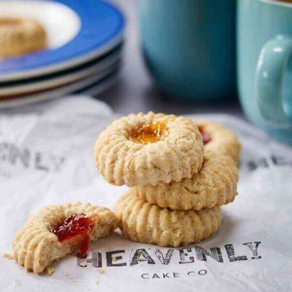 Vegan jammy dodger biscuits. Dripping with jam and baked to perfection