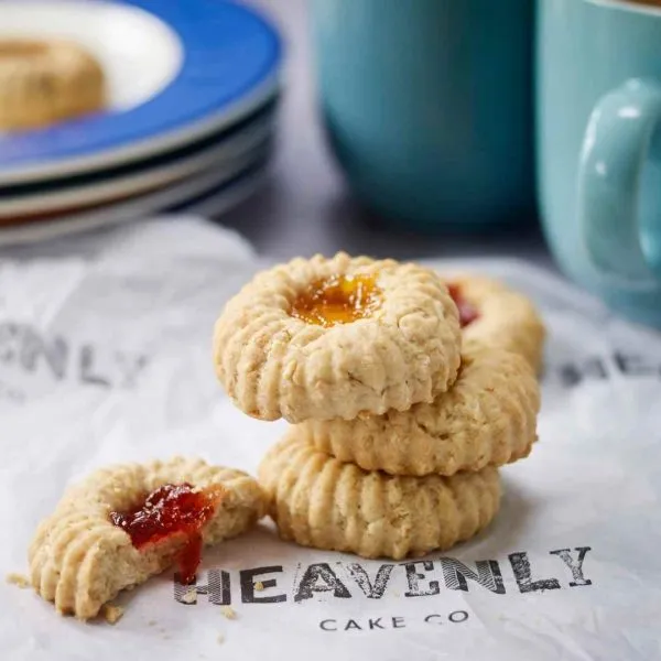 Vegan jammy dodger biscuits. Dripping with jam and baked to perfection